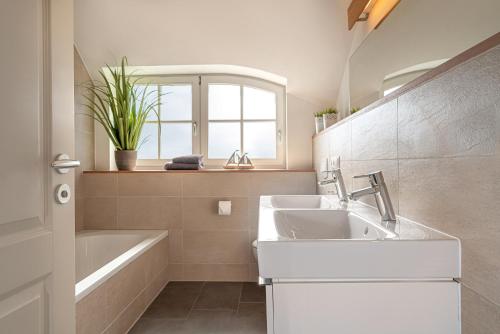 Ένα μπάνιο στο Ferien-im-Duenenhaus-Ole