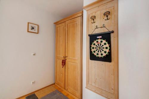 a dart board on a wall next to a door at Haus Lowe Appartement 1 Stock Nr 2 in Filzmoos