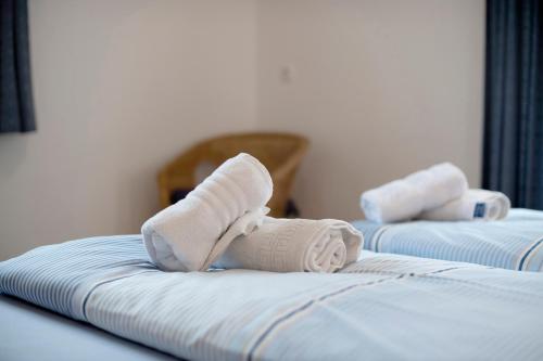 two towels on a bed in a hotel room at Haus Lowe Appartement 1 Stock Nr 2 in Filzmoos