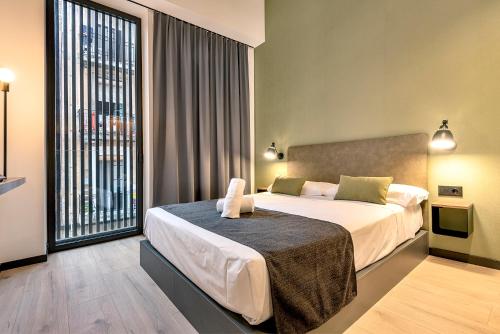Una cama o camas en una habitación de Hotel Orangine