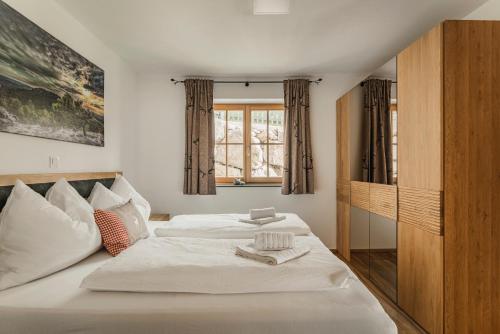 Posteľ alebo postele v izbe v ubytovaní Dachstein West Apartments