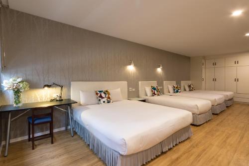Postel nebo postele na pokoji v ubytování Just Enjoy Business Hotel