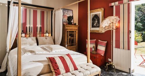 En eller flere senge i et værelse på La Maison d'Edith
