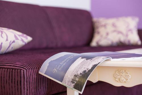 a book sitting on top of a couch at Hotel Restaurant zur Post in Melk