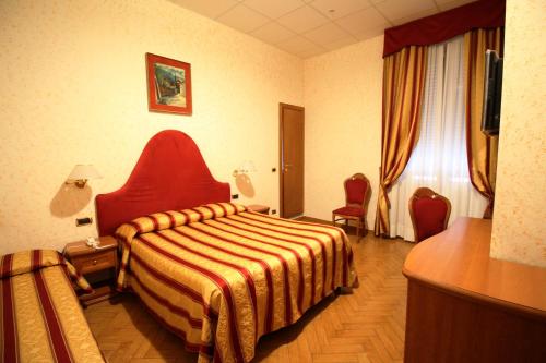 Krevet ili kreveti u jedinici u okviru objekta Hotel Brignole