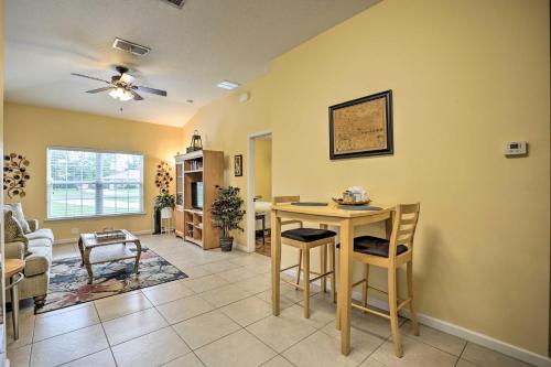 a living room with a table and chairs at Cozy Palatka Apartment Near St Johns River! in Palatka