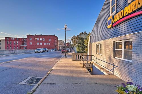 a building with a sign on the side of a street at Newly Renovated Penn Yan Apartment Less Than 1 Mi to Lake! in Penn Yan