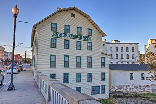 a building with a sign on the side of it at Newly Renovated Penn Yan Apartment Less Than 1 Mi to Lake! in Penn Yan