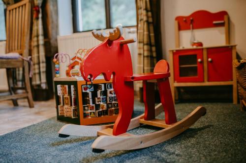 a toy horse on skis in a room at Penzion Panský dům in Kvilda
