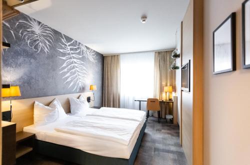 Säng eller sängar i ett rum på Hotel Das Himberg