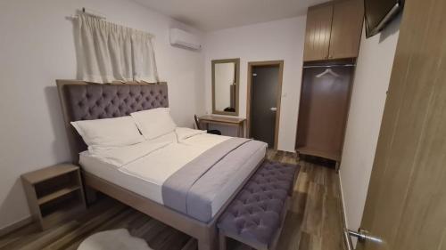 Posteľ alebo postele v izbe v ubytovaní KASNAR ROOMS