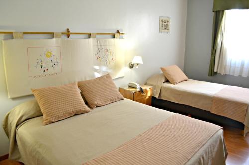 Tempat tidur dalam kamar di Apart San Lorenzo