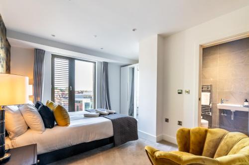 a bedroom with a bed and a large window at Skyview Retreat @ Ryedale House in York