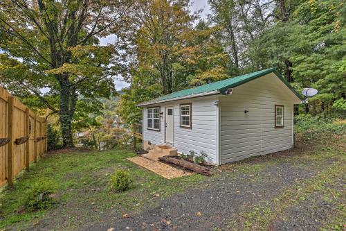 a small shed in a yard next to a fence at Hilltop Hideaway with Scenic Views and Hot Tub! in West Jefferson