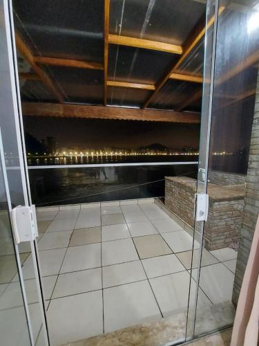 a balcony with a view of a city skyline at Sobrado com vista ao mar in São Vicente