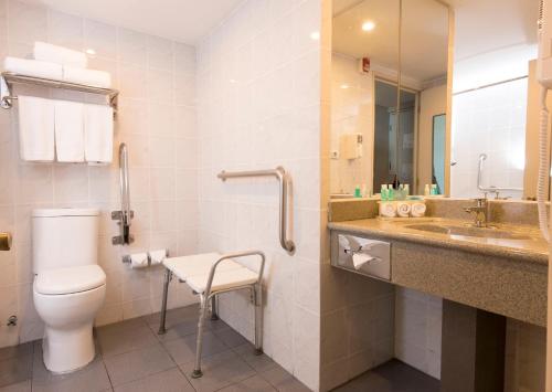 a bathroom with a toilet and a sink at Holiday Inn Express - Antofagasta by IHG in Antofagasta