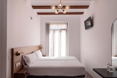 Llit o llits en una habitació de Hotel 19-30 Valencia