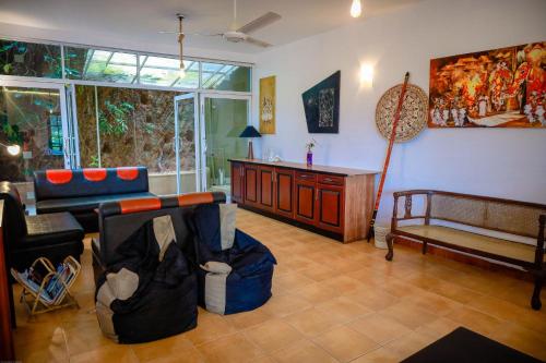 a living room with a couch and a table at Funk Bunks - Mount View in Kandy