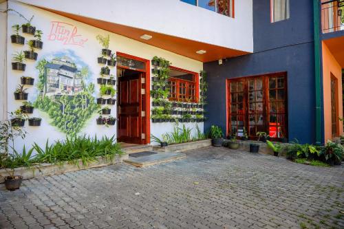 a building with plants on the side of it at Funk Bunks - Mount View in Kandy