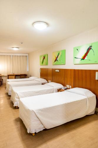 Katil atau katil-katil dalam bilik di Hotel Praia Centro