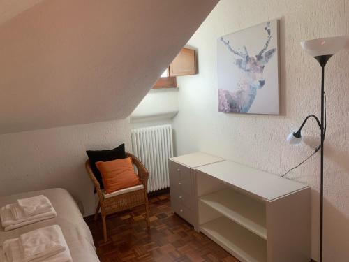 a bedroom with a white desk and a chair at Hameau De Jadis in Pré-Saint-Didier
