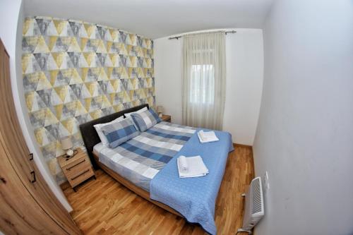 Postel nebo postele na pokoji v ubytování Apartmani Zecevic Niksic