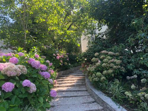 a garden with pink flowers and a pathway at Luxurious royal estate in historic Sintra paradise in Sintra
