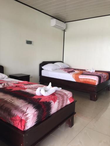 Cama o camas de una habitación en Hotel River View