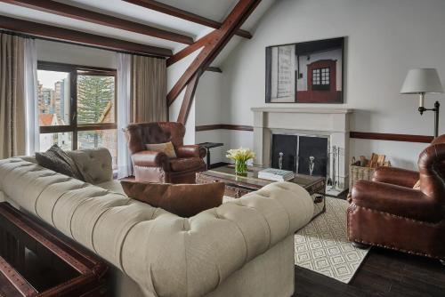 a living room with a couch and a fireplace at Four Seasons Hotel Casa Medina Bogota in Bogotá
