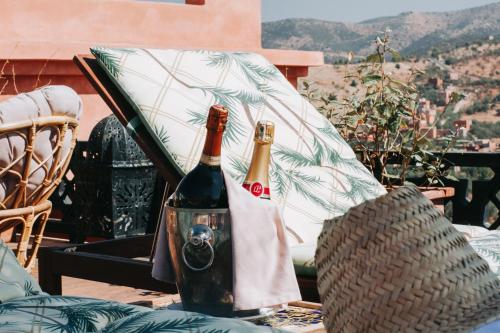 two bottles of wine sitting on top of a table at Borj Des Cascades & Spa in Ouzoud