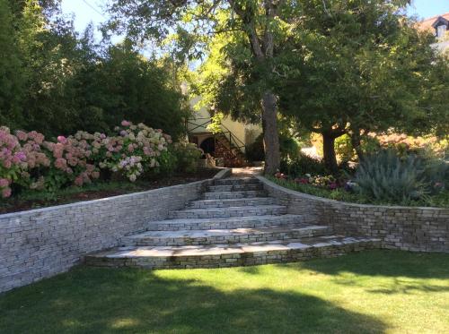a set of stone stairs in a yard with flowers at Luxurious royal estate in historic Sintra paradise in Sintra