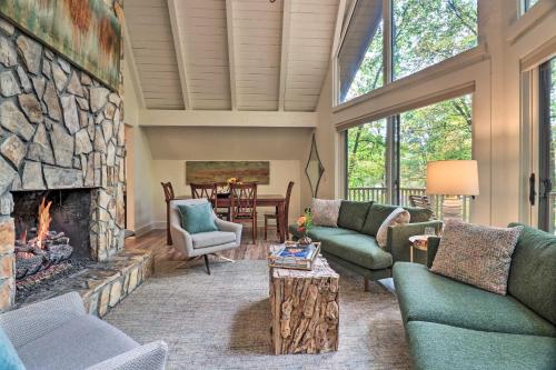 a large living room with a stone fireplace at 1 Mi to Town Chalet-Style Highlands Retreat in Highlands