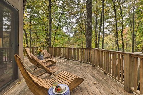 a wooden deck with chairs and a table on it at 1 Mi to Town Chalet-Style Highlands Retreat in Highlands