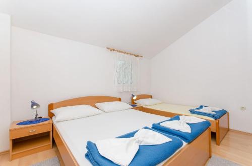 Postel nebo postele na pokoji v ubytování Apartments Zoran