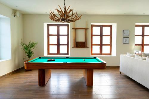 a living room with a pool table at Nukari Quinta Boutique in Jala