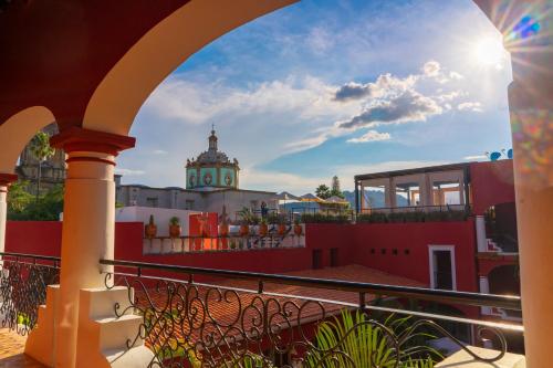a view from a balcony of a building with a clock tower at Nukari Quinta Boutique in Jala