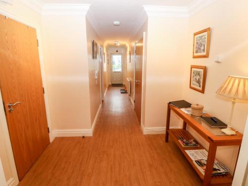 a hallway of a home with a long corridor at Linksway in Morfa Nefyn