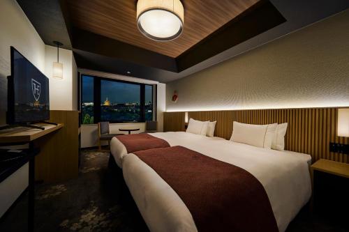 Кровать или кровати в номере The Royal Park Hotel Kyoto Umekoji