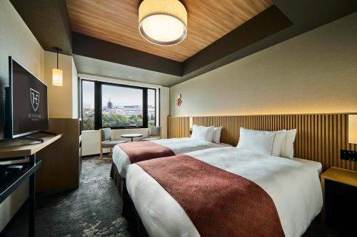 Кровать или кровати в номере The Royal Park Hotel Kyoto Umekoji