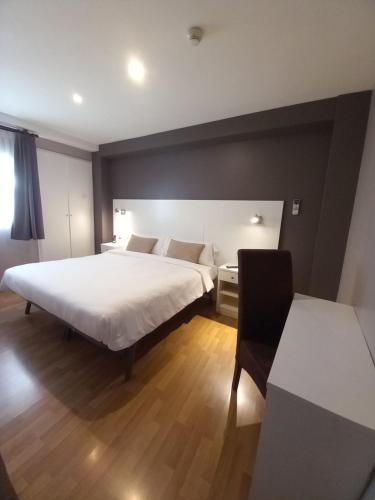 Ένα ή περισσότερα κρεβάτια σε δωμάτιο στο Hotel El Acebo
