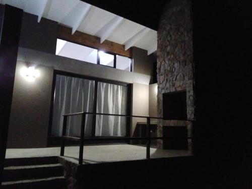 a room with a staircase and a large window at Fijnbosch Game Lodge Jeffreys Bay in Jeffreys Bay