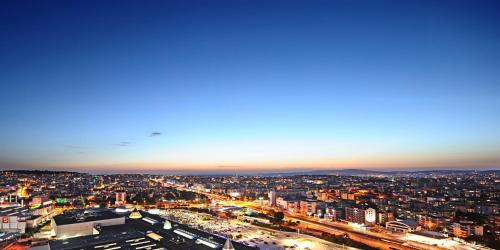 an aerial view of a city at night at Crowne Plaza Bursa Convention Center & Thermal Spa by IHG in Bursa