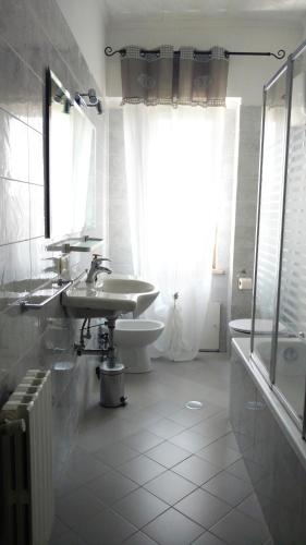 a bathroom with a sink and a toilet at TOP Apartment in Catanzaro