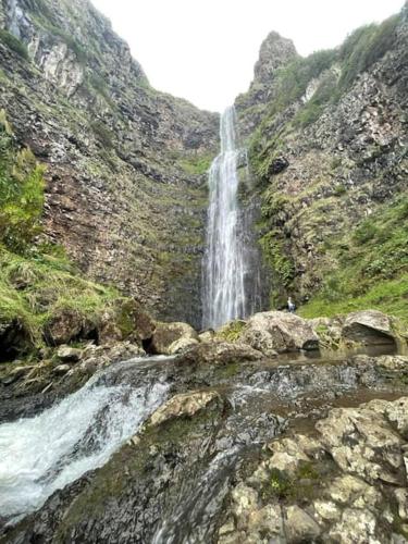 a waterfall on the side of a mountain at Apartamentos Lisboa in Vila do Porto