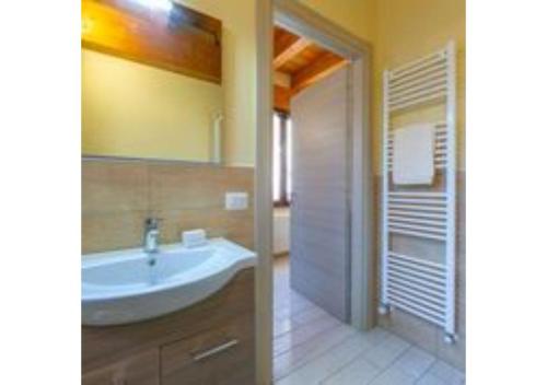 a bathroom with a sink and a mirror at Casa Terry in Madonna del Sasso