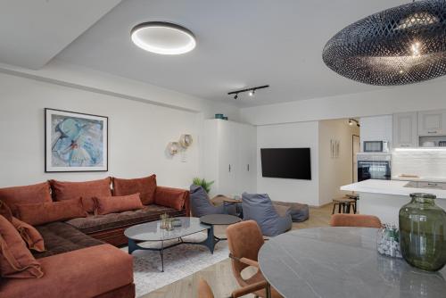 a living room with a couch and a table at Acropolis Premium Residence in Athens