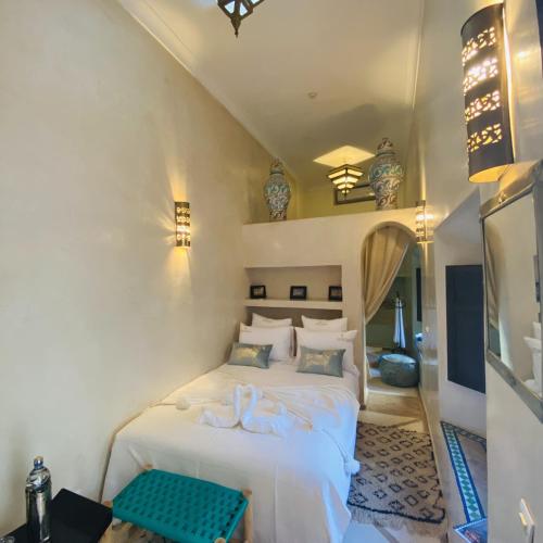 מיטה או מיטות בחדר ב-Riad Oasissime