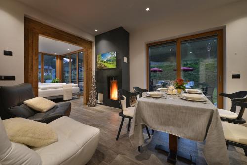 a living room filled with furniture and a fire place at Appartamenti Astra in Livigno