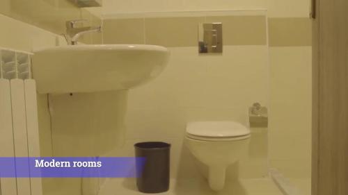 a bathroom with a white toilet and a sink at Al-Mujeb in Kerak