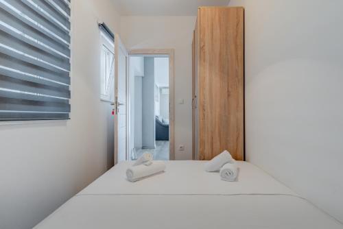 Postel nebo postele na pokoji v ubytování Apartmani Zaja